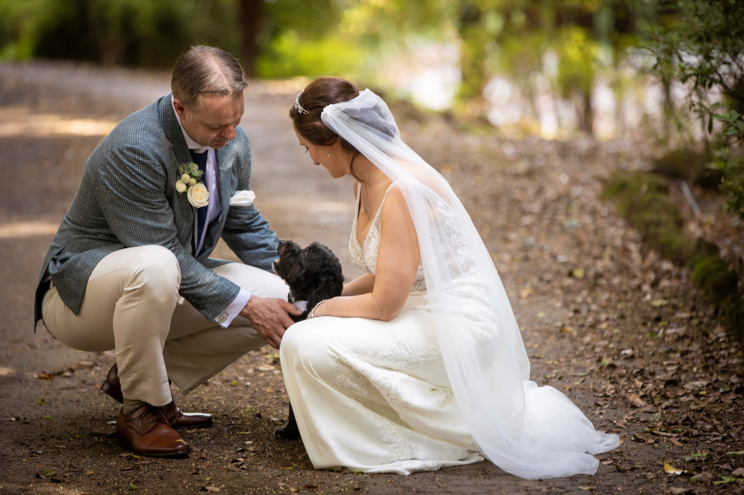 Su and Peter with their dog at wedding